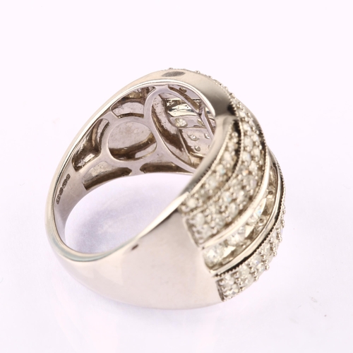 1203 - A large modern 18ct white gold diamond band ring, set with modern round brilliant and single-cut dia... 