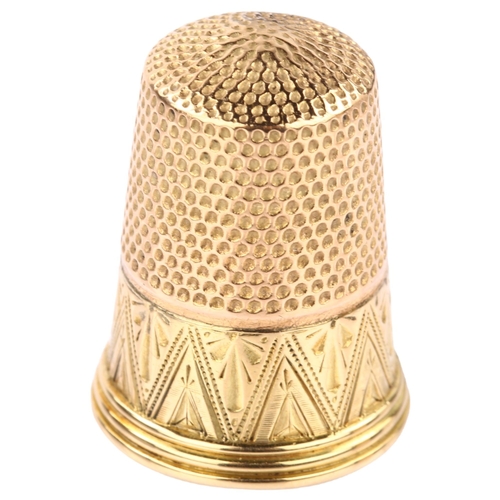 1207 - An Antique gold sewing thimble, bright-cut engraved decoration, stamped 14 and 9, thimble length 23.... 