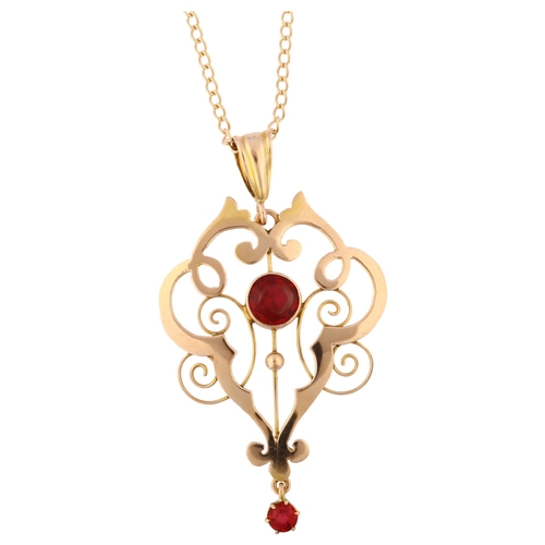 1209 - An Edwardian 9ct gold red paste openwork pendant necklace, on 9ct fine curb link chain, pendant heig... 