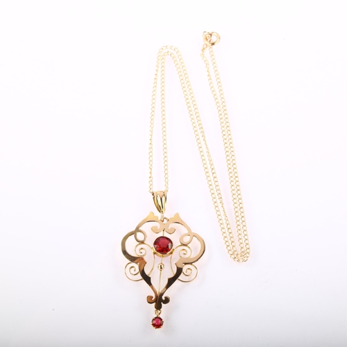 1209 - An Edwardian 9ct gold red paste openwork pendant necklace, on 9ct fine curb link chain, pendant heig... 