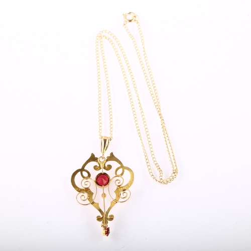 1209 - An Edwardian 9ct gold red paste openwork pendant necklace, on 9ct fine curb link chain, pendant heig... 