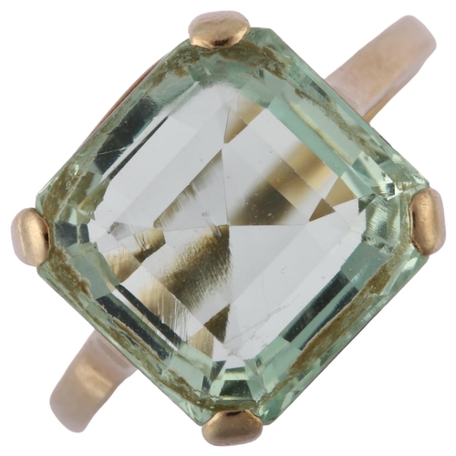 1210 - A solitaire aquamarine ring, unmarked white metal settings with square step-cut aquamarine, aquamari... 