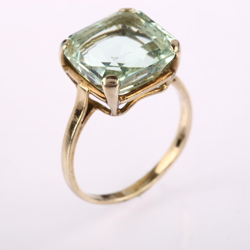 1210 - A solitaire aquamarine ring, unmarked white metal settings with square step-cut aquamarine, aquamari... 