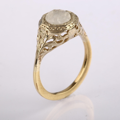 1217 - An Art Deco moonstone 'man in the moon' ring, unmarked gold settings with octagonal head and pierced... 