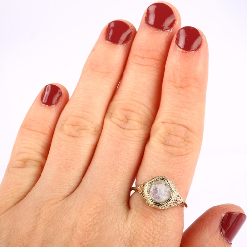 1217 - An Art Deco moonstone 'man in the moon' ring, unmarked gold settings with octagonal head and pierced... 