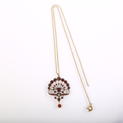 1218 - A Bohemian garnet floral pendant necklace, unmarked yellow metal closed-back settings, set with face... 