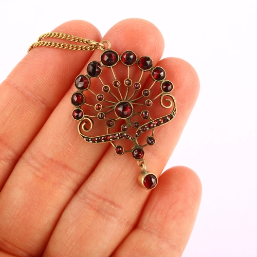 1218 - A Bohemian garnet floral pendant necklace, unmarked yellow metal closed-back settings, set with face... 