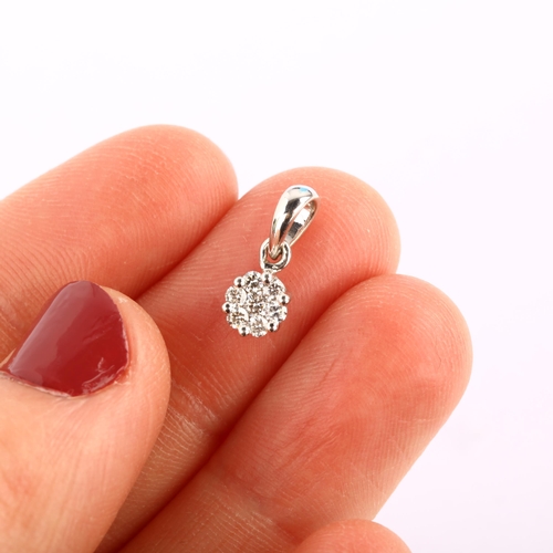 1219 - A modern 18ct white gold diamond cluster pendant, prong set with modern round brilliant-cut diamonds... 