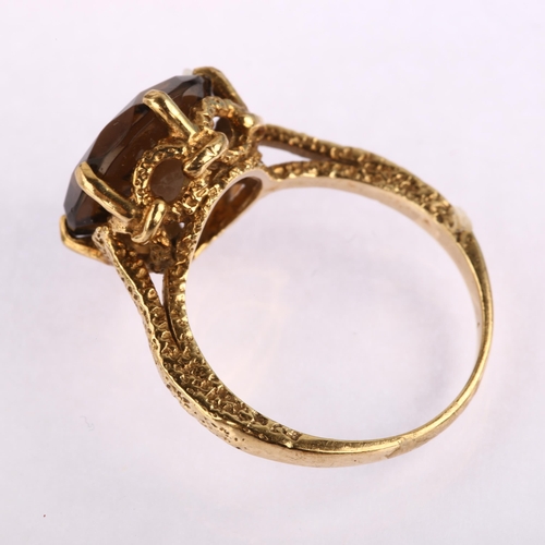 1221 - A late 20th century 9ct gold smoky quartz dress ring, set with round-cut quartz with textured should... 