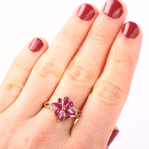 1225 - A modern 9ct gold ruby and diamond cluster flowerhead ring, setting height 14.1mm, size R, 2.8g