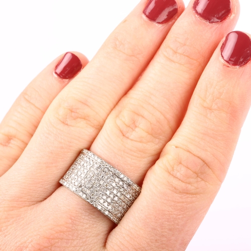 1226 - A large modern 18ct white gold diamond band ring, pave set with single-cut diamonds, total diamond c... 