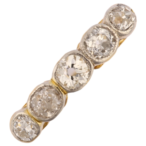 1229 - An 18ct gold graduated five stone diamond ring, bezel set with old-cut diamonds, total diamond conte... 