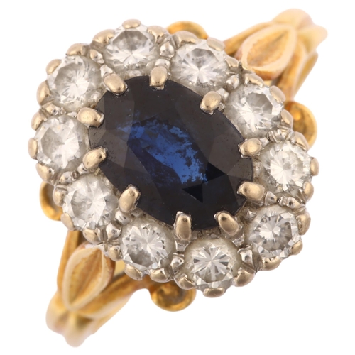 1230 - An 18ct gold sapphire and diamond oval cluster ring, set with oval mixed-cut sapphire and modern rou... 