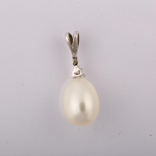 1237 - A modern cultured pearl and diamond drop pendant, unmarked white metal settings with 0.05ct modern r... 