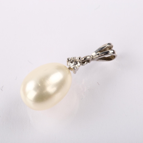 1237 - A modern cultured pearl and diamond drop pendant, unmarked white metal settings with 0.05ct modern r... 