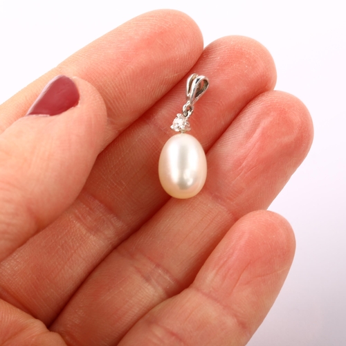 1237 - A modern cultured pearl and diamond drop pendant, unmarked white metal settings with 0.05ct modern r... 