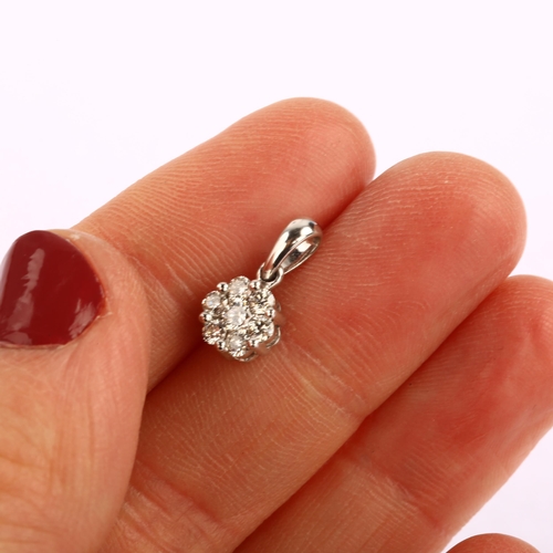 1270 - A modern 9ct white gold diamond flowerhead cluster pendant, prong set with modern round brilliant-cu... 