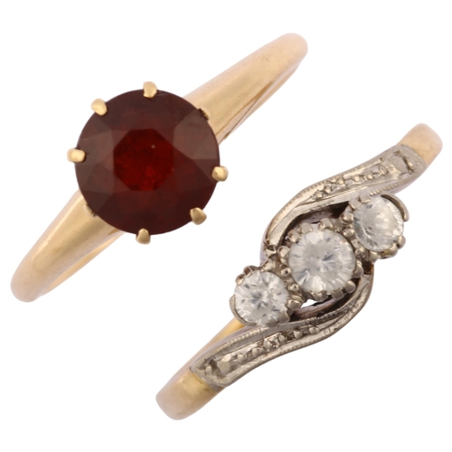 1287 - A 14ct gold solitaire garnet ring, size P, 3.3g, and a 9ct gold white sapphire crossover ring, size ... 