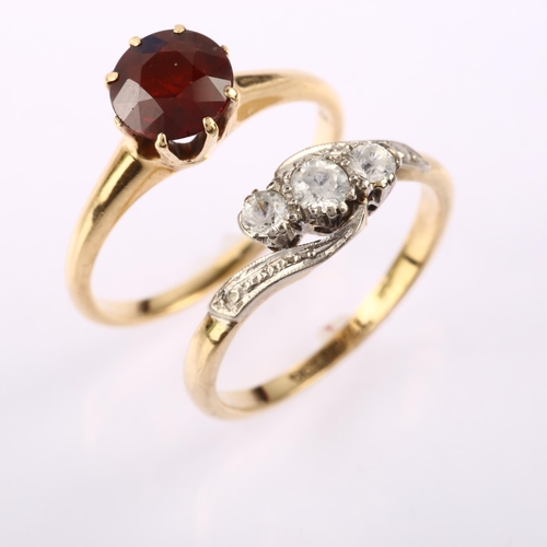 1287 - A 14ct gold solitaire garnet ring, size P, 3.3g, and a 9ct gold white sapphire crossover ring, size ... 