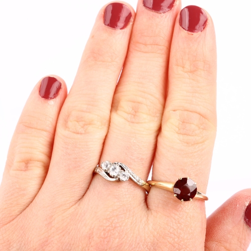 1287 - A 14ct gold solitaire garnet ring, size P, 3.3g, and a 9ct gold white sapphire crossover ring, size ... 