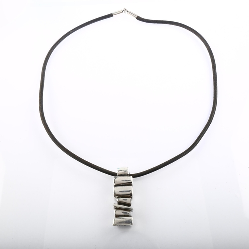 1297 - ANETTE KRAEN - a large and heavy Danish brutalist sterling silver abstract pendant necklace, on leat... 