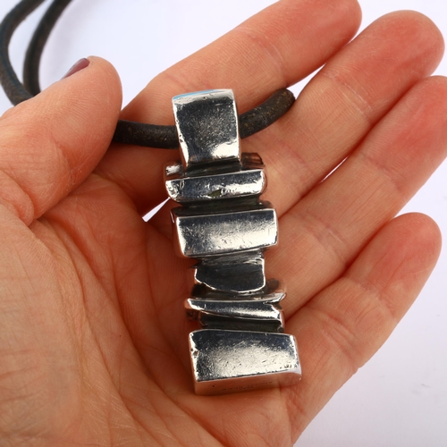 1297 - ANETTE KRAEN - a large and heavy Danish brutalist sterling silver abstract pendant necklace, on leat... 