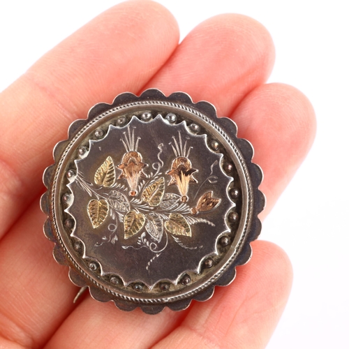 1303 - A Victorian silver and gold floral photo locket brooch, relief embossed applied and engraved decorat... 