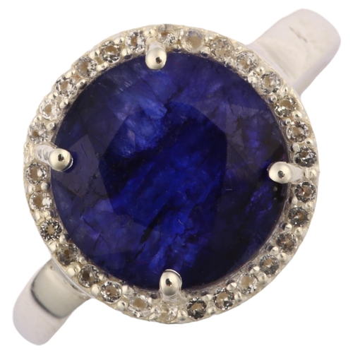 1308 - A modern sterling silver sapphire and white topaz cluster ring, set with 4ct African sapphire, setti... 