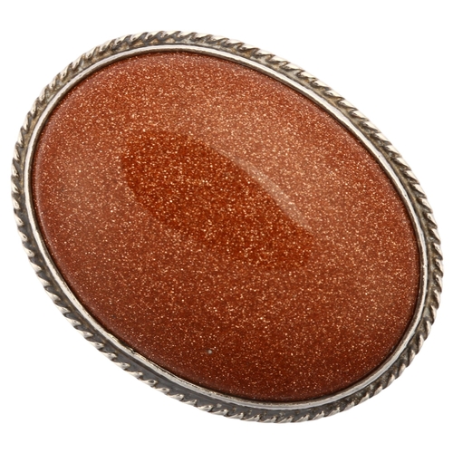 1317 - A Danish modernist sterling silver goldstone panel ring, with double shank, set with oval cabochon g... 