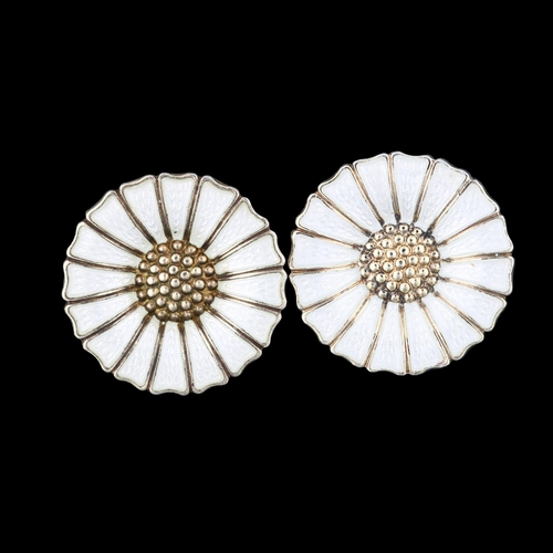 1318 - ANTON MICHELSEN - a pair of Danish vermeil sterling silver and white enamel daisy pattern clip-on ea... 