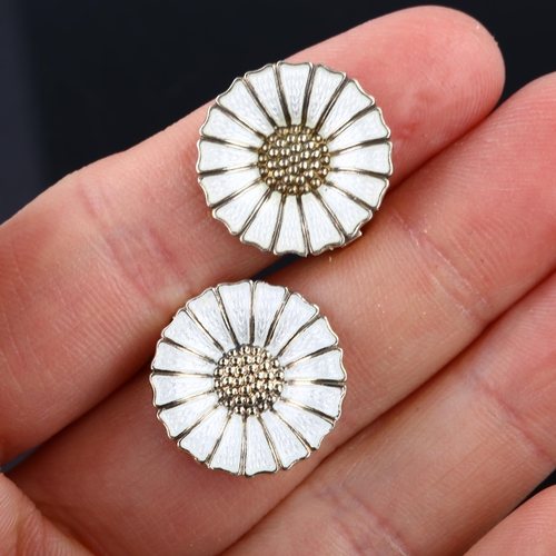 1318 - ANTON MICHELSEN - a pair of Danish vermeil sterling silver and white enamel daisy pattern clip-on ea... 