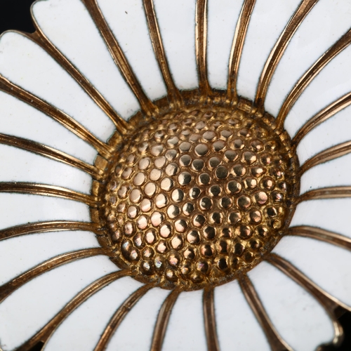 1320 - BERNHARD HERTZ - a Danish vermeil sterling silver and white enamel daisy pattern brooch, diameter 43... 