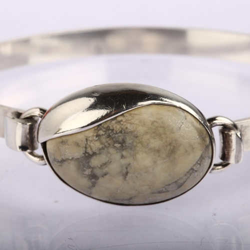 1339 - HANS HENRIK NYGAARD - a Danish modernist sterling silver howlite torque bracelet, setting height 19.... 