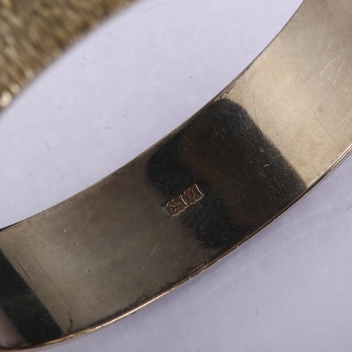 1342 - A mid-20th century silver hinged bangle, textured decoration, maker's marks B Ltd, hallmarks Birming... 