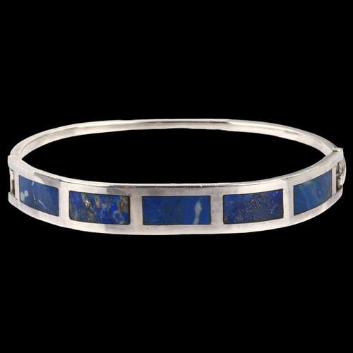 1367 - A Chilean silver and lapis lazuli torque bracelet, setting height 9.6mm, internal circumference 17cm... 