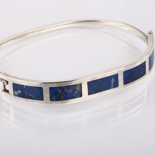 1367 - A Chilean silver and lapis lazuli torque bracelet, setting height 9.6mm, internal circumference 17cm... 