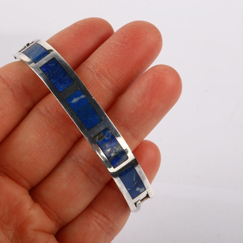 1367 - A Chilean silver and lapis lazuli torque bracelet, setting height 9.6mm, internal circumference 17cm... 