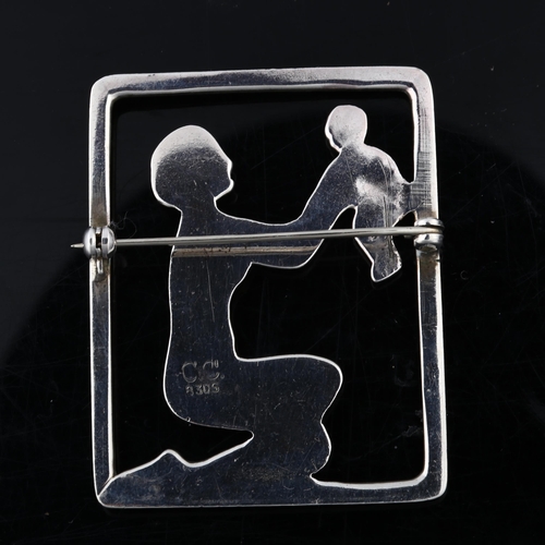 1376 - C C CHRISTENSEN - an Art Deco Danish silver figural mother and child openwork brooch, height 51mm, 1... 