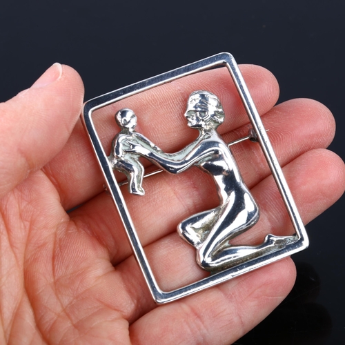 1376 - C C CHRISTENSEN - an Art Deco Danish silver figural mother and child openwork brooch, height 51mm, 1... 