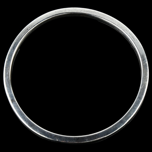 1385 - CARL OVE FRYDENSBERG - a Danish modernist sterling silver plain form slave bangle, band width 3.6mm,... 