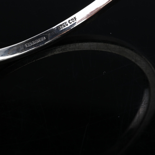 1385 - CARL OVE FRYDENSBERG - a Danish modernist sterling silver plain form slave bangle, band width 3.6mm,... 