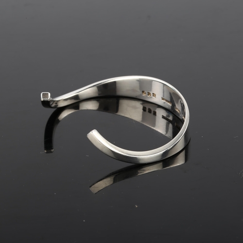 1390 - FRANK AHM - a Danish modernist sterling silver plain form cuff bangle, model no. 580, setting height... 