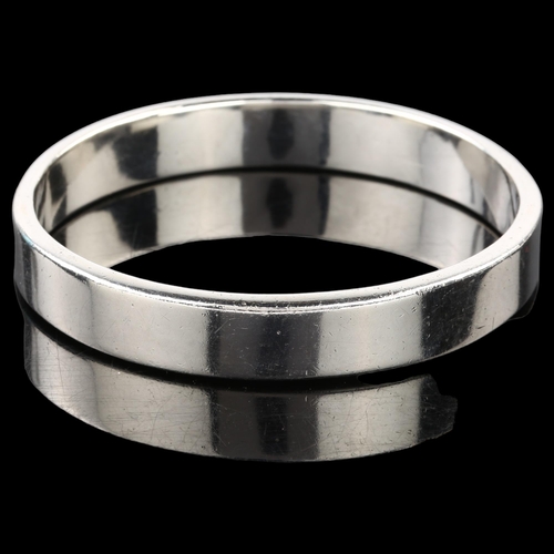 1392 - PETER HENNINGSEN - a heavy Danish sterling silver plain form bangle, band width 11.6mm, internal cir... 