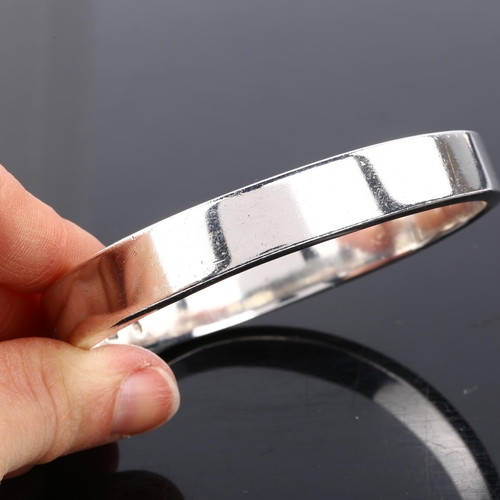 1392 - PETER HENNINGSEN - a heavy Danish sterling silver plain form bangle, band width 11.6mm, internal cir... 