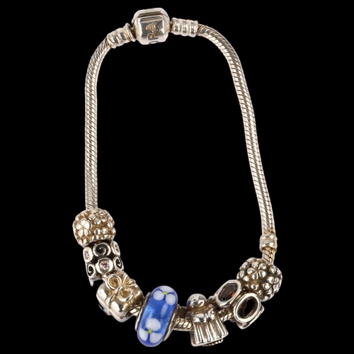 1394 - PANDORA - a sterling silver snake link charm bracelet, with 7 silver charms, length 18.5cm, 38.5g. b... 