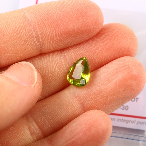 1401 - A 2.03ct unmounted pear-cut peridot, 9.78 x 7.86 x 4.03mm, with GFCO Gemlab report