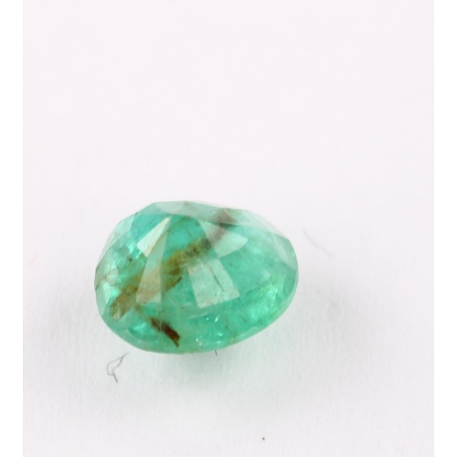 1403 - A 0.75ct unmounted oval mixed-cut emerald, 6.60 x 5.83 x 4.07mm, with GLA report card