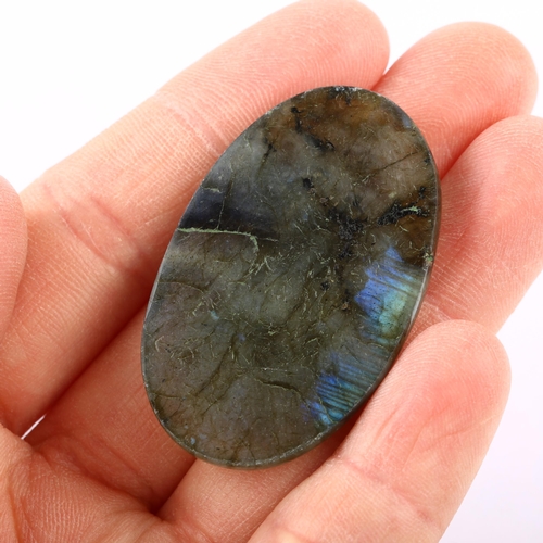 1408 - A 76.40ct unmounted oval cabochon labradorite, 43.23 x 27.42 x 7.86mm, with IDT gemstone report