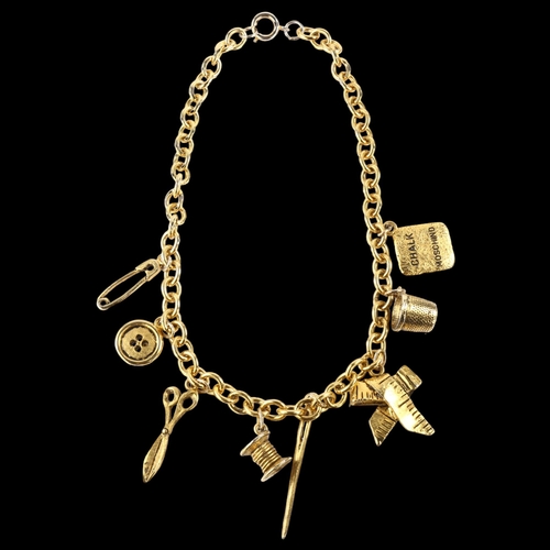 1411 - MOSCHINO - a Vintage gold plated tailor's sewing tools charm necklace, length 40cm, boxed