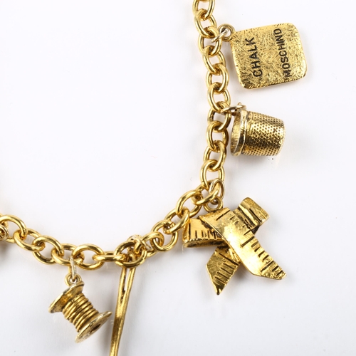 1411 - MOSCHINO - a Vintage gold plated tailor's sewing tools charm necklace, length 40cm, boxed